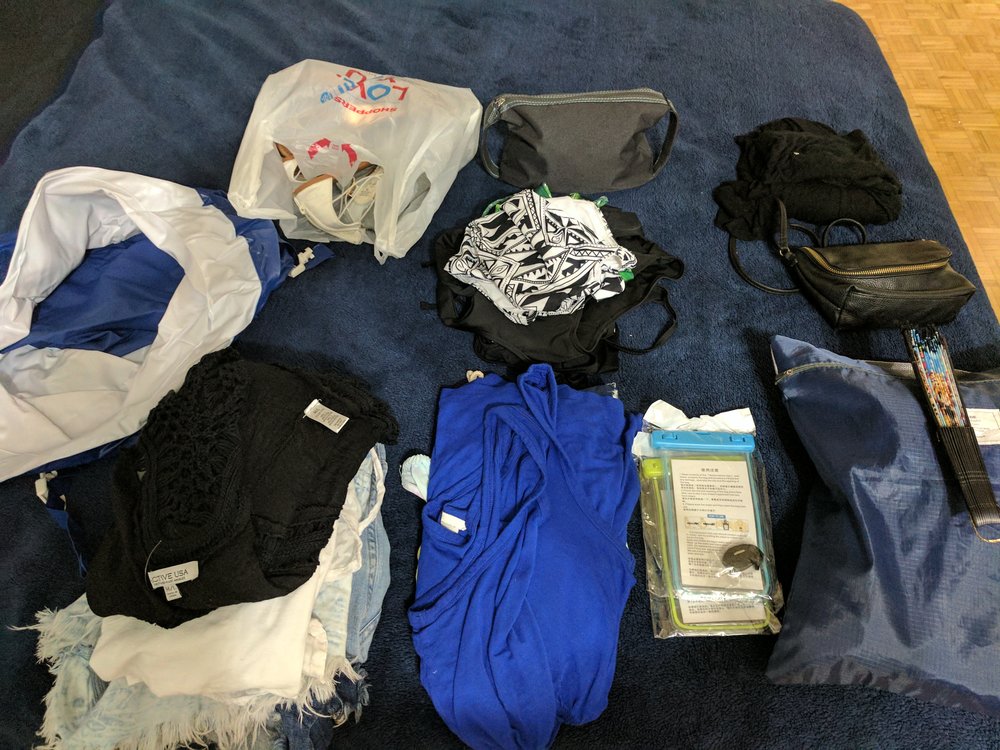  All the things going into the carry-on ( the blue and white in the left corner is the inflatable cooler )  